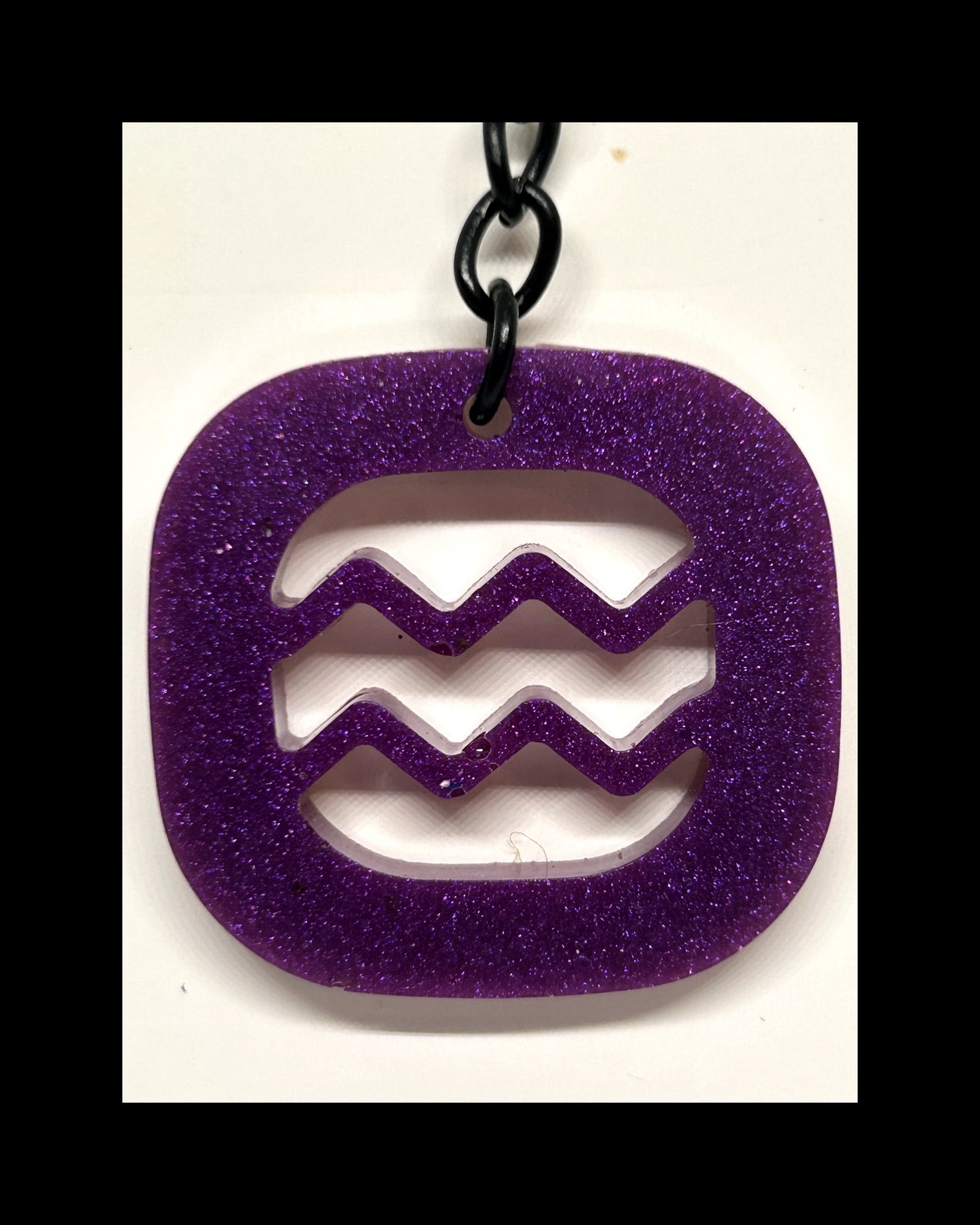 Plum resin zodiac keychains