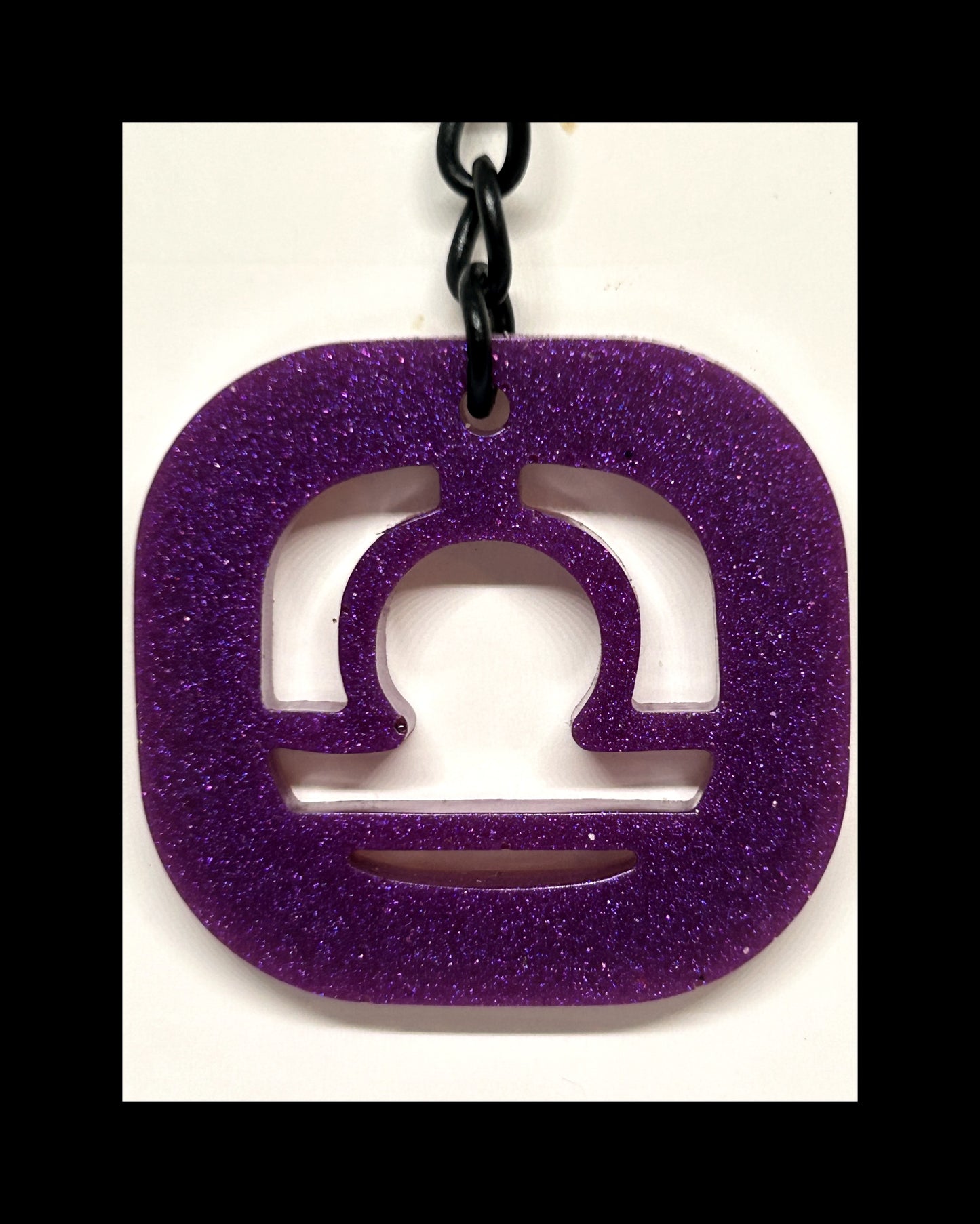 Plum resin zodiac keychains