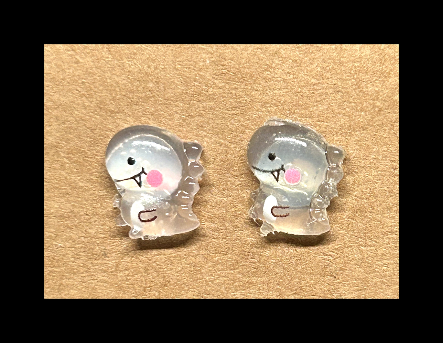 UV reactive dino stud earrings